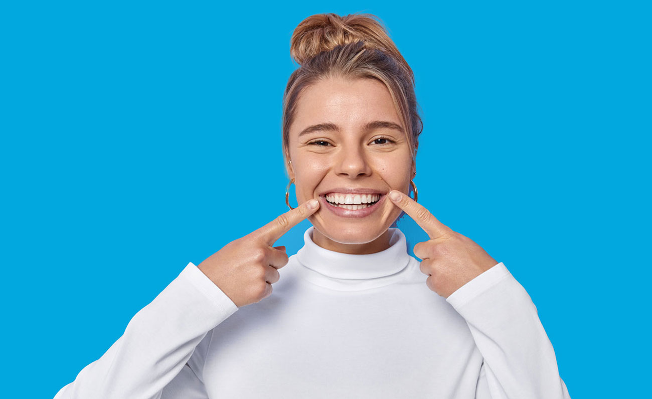 Girl smiling after using clear aligners